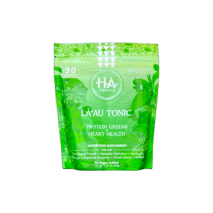 A green resealable pouch of HĀ Tonics Lāʻau Tonic Protein Greens Heart Health superfood supplement, 30 servings, plant-based protein, with illustrated green leaves on the packaging.