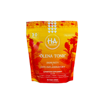 A yellow and orange pouch labeled HA Tonics Olena Tonic with Immunity Anti-Inflammatory and Prebiotic text, showing floral graphics and stating 30 servings and no sugar added.